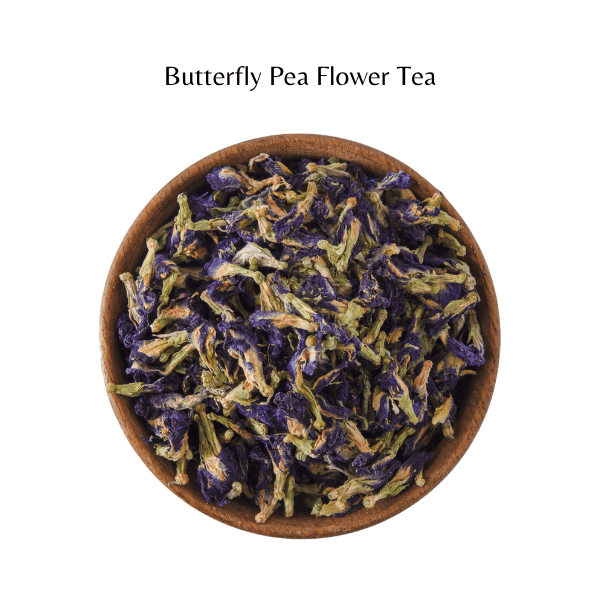 Butterfly pea flower tea in a wooden bowl on a white background