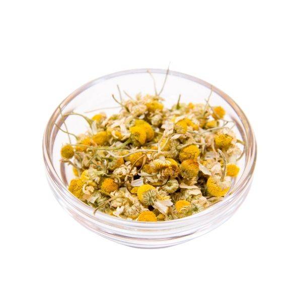 Clear glass bowl filled with dried Dried Chamomile Flowers 