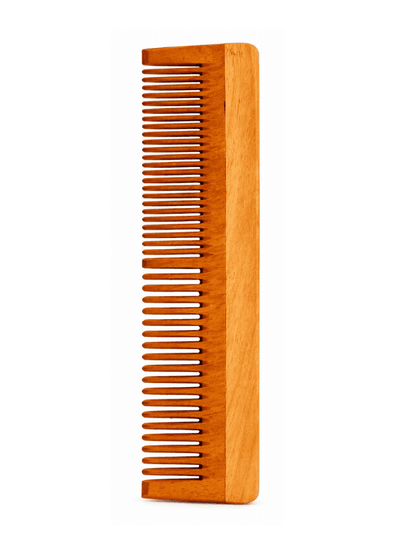 Wooden comb on a white background