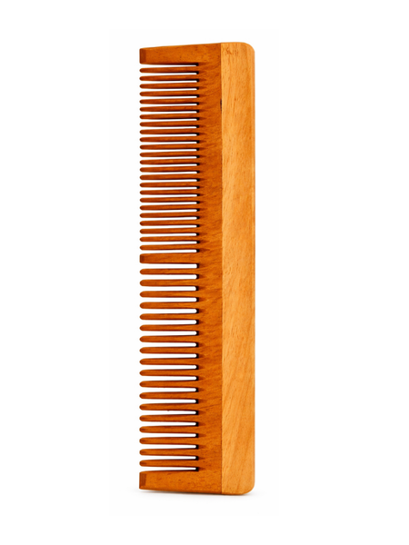 Wooden comb on a white background