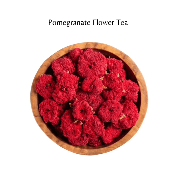 Pomegranate flower tea in a wooden bowl on a white background